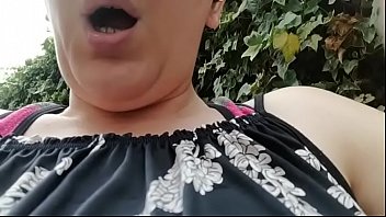 Your beautiful Italian mom smashes her pussy with this huge dildo in a green public place