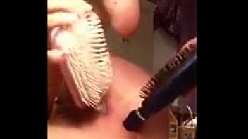 6110716 girl puts hairbrush in her pussy and asshole