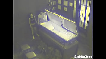 Two People having sex in a Coffin before the service