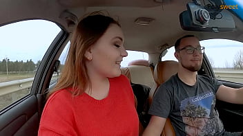 Girl gives a blowjob while the guy drives the car